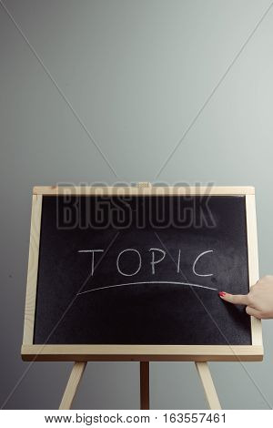 Topic Written In White Chalk On A Black Chalkboard