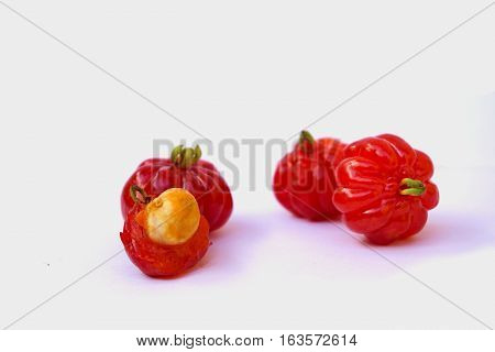Ripe barbados cherry fruit on white background.