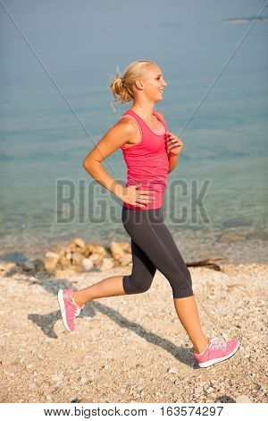 Jogging In Th Beach - Woman Runns Near Sea On Early Summer Morning