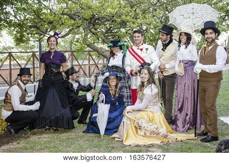 CAGLIARI, ITALY - May 29, 2016: Sunday at La Grande Jatte VIII Ed. At the Public Gardens - Sardinia - group of people in Victorian costumes