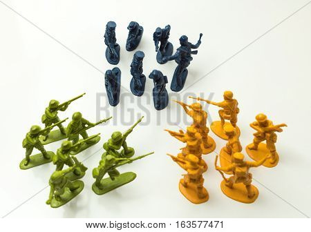 Small plastic toy soldiers on white background