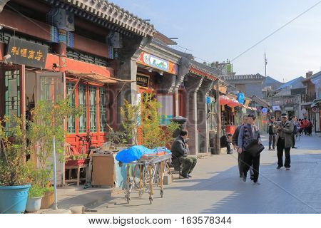 BEIJING CHINA - OCTOBER 26, 2016: Unidentified people visit Houhai lake Futong street.