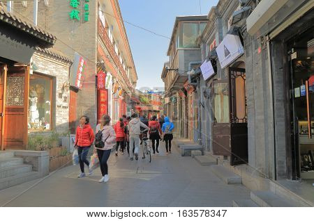 BEIJING CHINA - OCTOBER 26, 2016: Unidentified people visit Houhai lake Futong street.