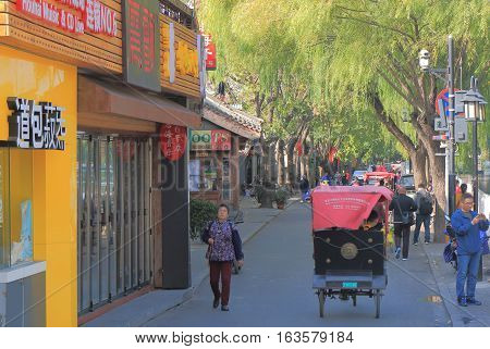 BEIJING CHINA - OCTOBER 26, 2016: Unidentified people visit Houhai lake Futong street.