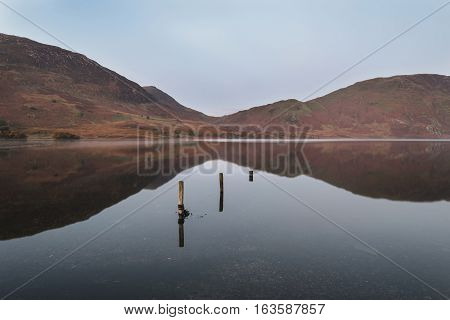 Beautiful Autumn Fall Landscape Image Of Crummock Water At Sunrise In Lake District England