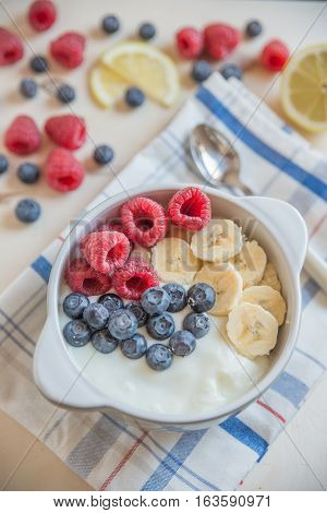Healthy Yogurt with fresh fruit on a table