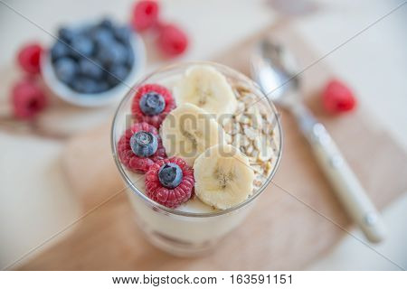 Healthy Yogurt with fresh fruit on a table