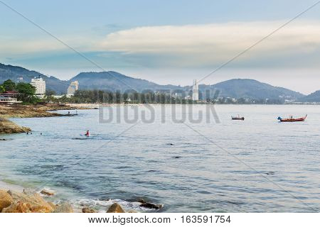 Kalim beach and Patong beach on twilight cloudy day Phuket Thailand. It is well-known destination for tourists all over the world.