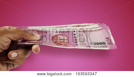 New Indian Rupee 2000 Currency Note in a Hand