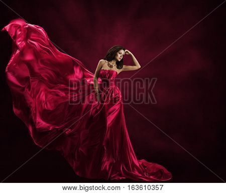 Fashion Model Dress Woman in Flying Gown Silk Fabric Waving on Wind Satin Cloth Flowing Waves