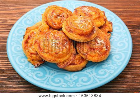 Puff pastry rolls with ham and cheese. Food for parties. Snack.