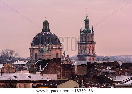 Evening Lviv. View of the central part of the city and churches: Church of the Holy Communion Korniakt Tower.