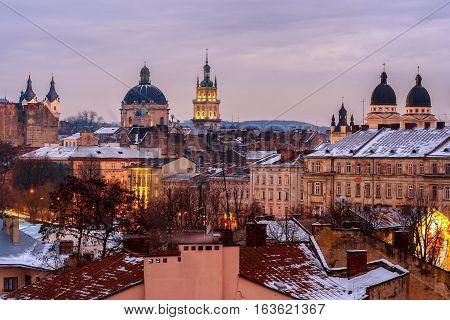 Evening Lviv. View of the central part of the city and churches: St. Michael's Ukrainian Catholic Church Church of the Holy Communion Korniakt Tower Armenian cathedral Transfiguration Church.