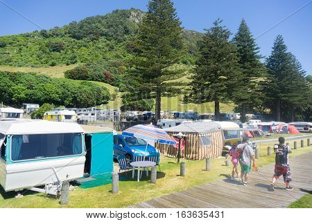 Tauranga New Zealand, December 20, 2016; Summer holidays, Kiwi-style at Mount Maunganui old -style caravans along the Mount Camping Ground beach-front sites