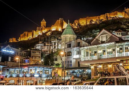 Georgia Tbilisi night . View from Gorgasali square of the old town the fortress Narikala Cathedral of Surb Gevorg .