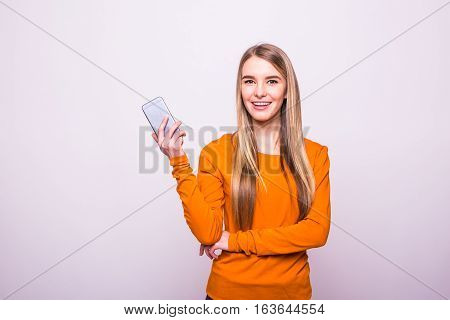 Blonde Girl With Phone In Hands On White