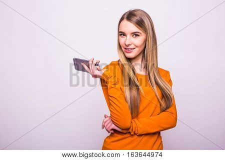 Blonde Girl With Phone In Hands On White