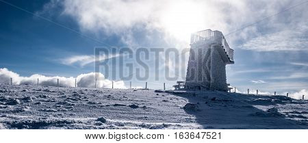 stony view tower covered by ice on Pretulalpe hill in winter Fischbacher Alpen mountains in Styria