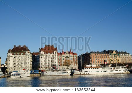 STOCKHOLM, SWEDEN - DECEMBER 14: City view with white boats in Nybroviken in the center of Stockholm in Sweden on December 14, 2016.