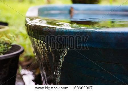 Water flowing out of the water storage containers.