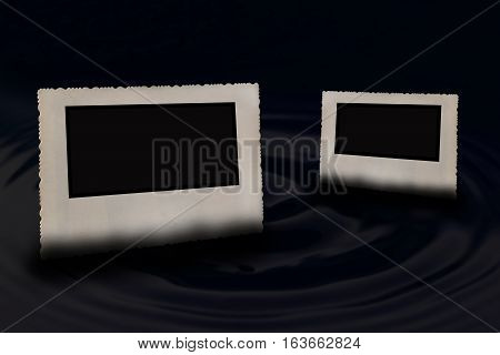 Two bevelled old vintage photo frames with jagged edges horizontally partially submerged in the water circle wave. One photo is in the foreground and a second smaller in the background.