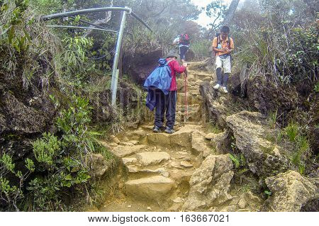 Ranau,Sabah,Malaysia-Apr 29,2014:Climbers seen at Timpohon trail from Laban Rata of Mount Kinabalu.The best time to climb Mt Kinabalu is between March & August which are the dry season of Sabah,Borneo