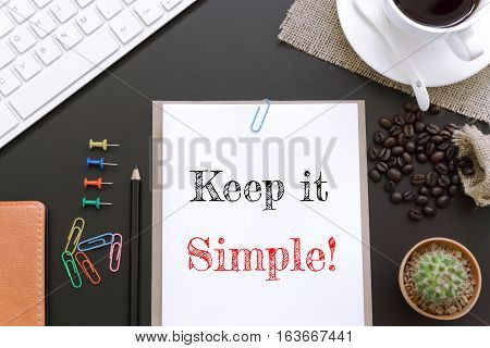 Text Keep it simple on white paper background / business concept