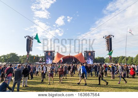 Roskilde, Denmark - June 30, 2016: Crowd of spectators enjoying a concert at the orange stage at Roskilde Festival 2016