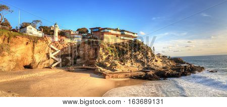 Blue sky over the coastline of One Thousand Steps Beach with tidal pools and cliffs in Laguna Beach, California, USA