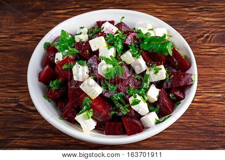 Healthy beetroot, feta cheese salad with parsley.