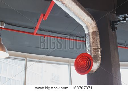Rounded duct work metal grill. Industrial ventilation.