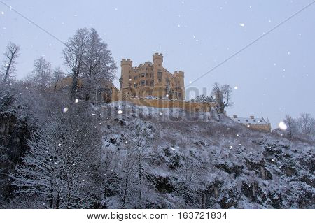 Fussen Germany - December 26 2014: view of Hohenschwangau Castle in Bavarian Alps in winter time on December 26 2014 near Fussen Germany.