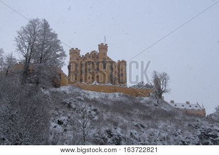Fussen Germany - December 26 2014: view of Hohenschwangau Castle in Bavarian Alps in winter time on December 26 2014 near Fussen Germany.