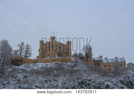 Fussen Germany - December 26 2014: view of Hohenschwangau Castle in Bavarian Alps in winter time on December 26 2014 near Fussen Germany.