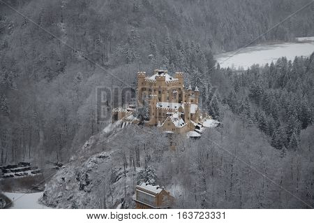 Fussen Germany - December 26 2014: view of Hohenschwangau Castle in Bavarian Alps in winter time on December 26 2014 near Fussen Germany.