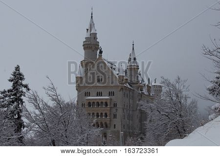 Fussen Germany - December 26 2014: view of the Neuschwanstein Castle in winter time on December 26 2014 near Fussen Germany.