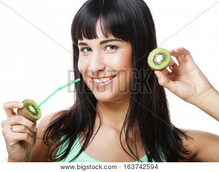 Beautiful close-up portrait of young woman with kiw juice. Healthy food concept.