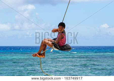 Lavena, Fiji - November 27: Unidentified Girl Swings On A Rope Swing On November 27, 2013 In Lavena