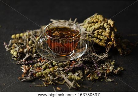 Transpatent Cup Of Herbal Tea With Dried Herbs
