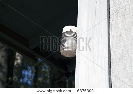 Porch light on the side of a house