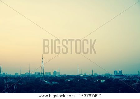 In large cities the evening sky the sun sets in colour tone.