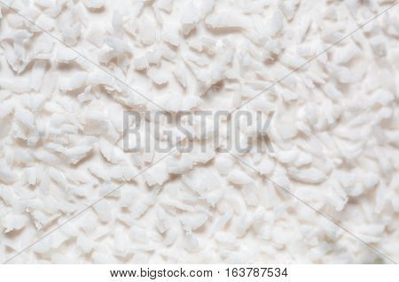 white coconut shavings on the cake. background and texture