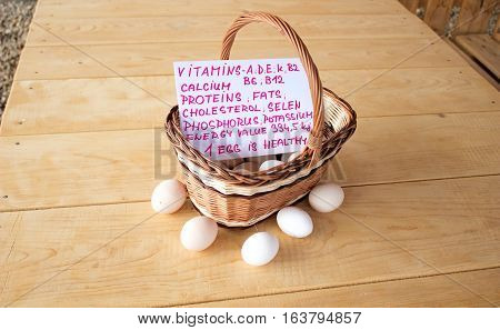 Quality chicken eggs from domestic breeding in a wicker basket