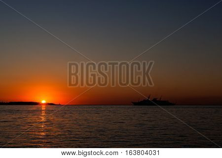 Sunrise over Cap d'Antibes view from Palm Beach at Point Croisette in Cannes Cote d'Azur France