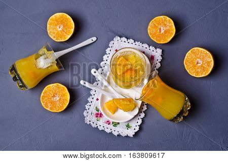 Orange jelly in glass with fruit pieces. Selective focus.