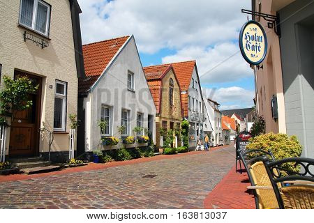 Schleswig Germany-may 21 2008:Street of the old town with small houses with tiled roofs. Fishing village the Hill