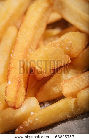 Fried and tasty. Close up of delicious French fries being served in restaurant.