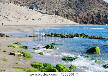 Volcanic rock-formations at Playa de Monsul. Famous beach in the Cabo de Gata-Nijar Natural Park. Province of Almeria. Spain