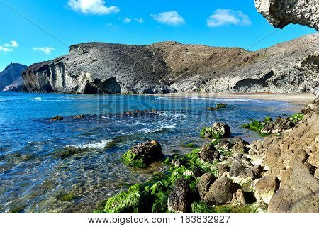 Volcanic rock-formations at Playa de Monsul. Famous beach in the Cabo de Gata-Nijar Natural Park. Province of Almeria. Spain