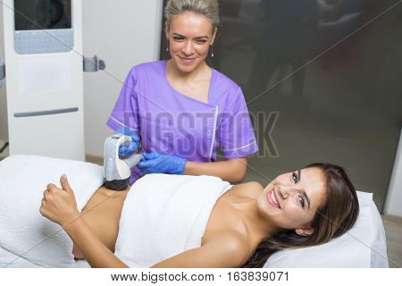 beauty treatment of a young woman in specialized clinic